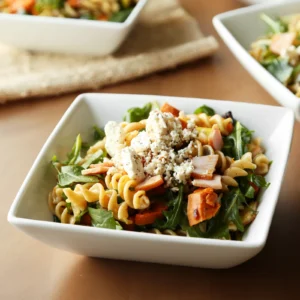 11:38 AMClaude responded: A white square bowl of roasted sweet potato and Canadian bacon pasta salad with rotini, diced Jones Canadian Bacon, roasted sweet potatoes, baby arugula, and c…A white square bowl of roasted sweet potato and Canadian bacon pasta salad with rotini, diced Jones Canadian Bacon, roasted sweet potatoes, baby arugula, and crumbled feta cheese, with additional servings in the background.