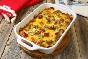 Fully Loaded Cheesy Breakfast Casserole with bacon, sausage, cheese, and hash browns, cheesy breakfast casserole