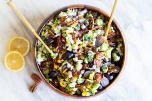 Broccoli bacon salad with Jones Dairy Farm bacon, red grapes, orange bell pepper, and pecans in a tahini dressing