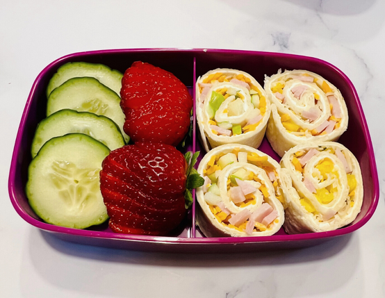 Canadian Bacon & Apple Pinwheels in a Bento Box with fruit and veggies