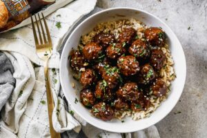 Meatballs with an Asian-inspired sauce served over rice.