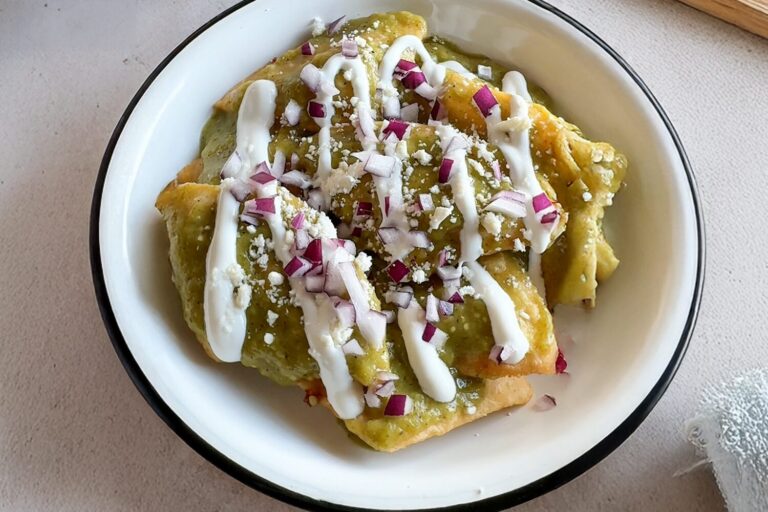 Breakfast Chilaquiles with Jones Dairy Farm Sausage Roll, salsa verde, sour cream, and red onions.