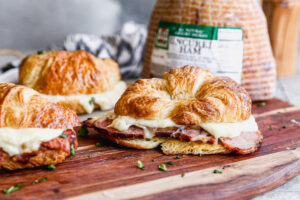 Three Croque Monsieur Croissant sandwiches with a Jones Dairy Farm Uncured Heritage Ham
