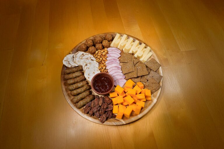 A cheese board featuring sausage, meatballs, and Canadian bacon, sausage and cheese pairings, Charcuterie Board, Charcuterie ideas, sausage pairings
