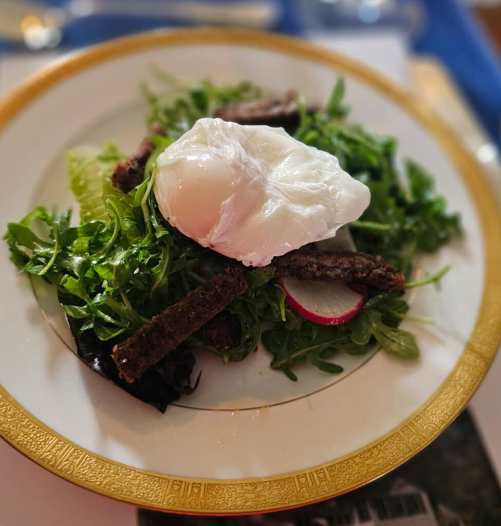 Arugula and Baby Greens, Jones Dairy Farm Scrapple Lardon, Poached Egg, Radish Champagne Vinaigrette