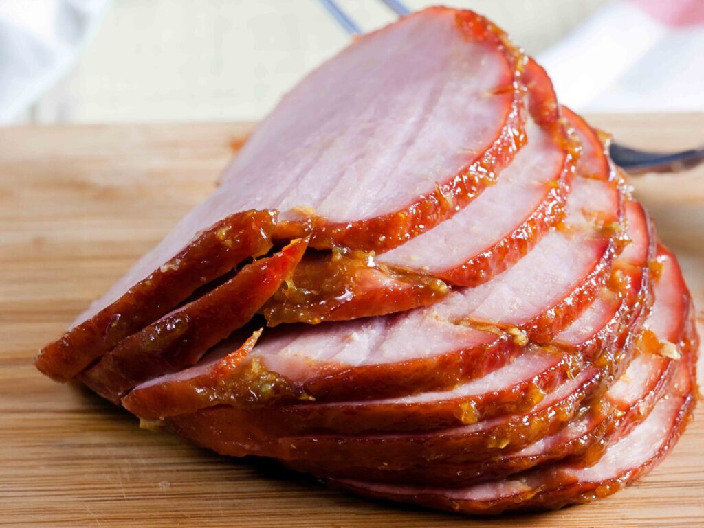 Hickory smoked ham with signature glaze at foodservice event, Why Jones Ham is the Top Choice for Foodservice and Catering, foodservice ham, catering ham, glazed ham foodservice, carving station ham