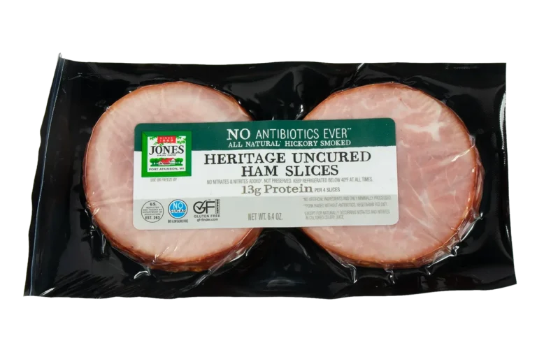 Jones Dairy Farm No Antibiotics Ever Heritage Uncured Ham Slices, 6.4 oz, all natural hickory smoked, Certified Gluten Free with no sugar, no nitrates or nitrites added, and 13g protein per 4 slices, in vacuum-sealed black packaging.