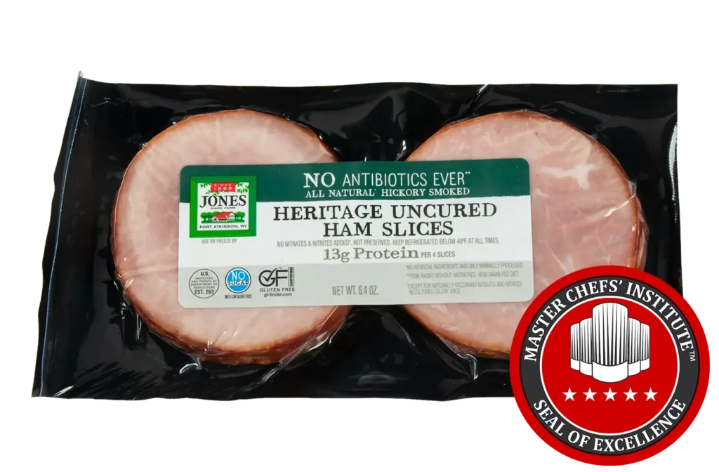 Jones Dairy Farm No Antibiotics Ever Heritage Uncured Ham Slices, 6.4 oz, all natural hickory smoked, Certified Gluten Free with no sugar, no nitrates or nitrites added, and 13g protein per 4 slices, in vacuum-sealed black packaging, with MCI Master Chefs' Institute Seal of Excellence