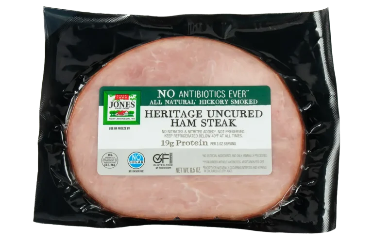 Jones Dairy Farm No Antibiotics Ever Heritage Uncured Ham Steak, 6.5 oz, all natural hickory smoked, Certified Gluten Free with no sugar, no nitrates or nitrites added, and 19g protein per 3 oz serving, in vacuum-sealed black packaging.