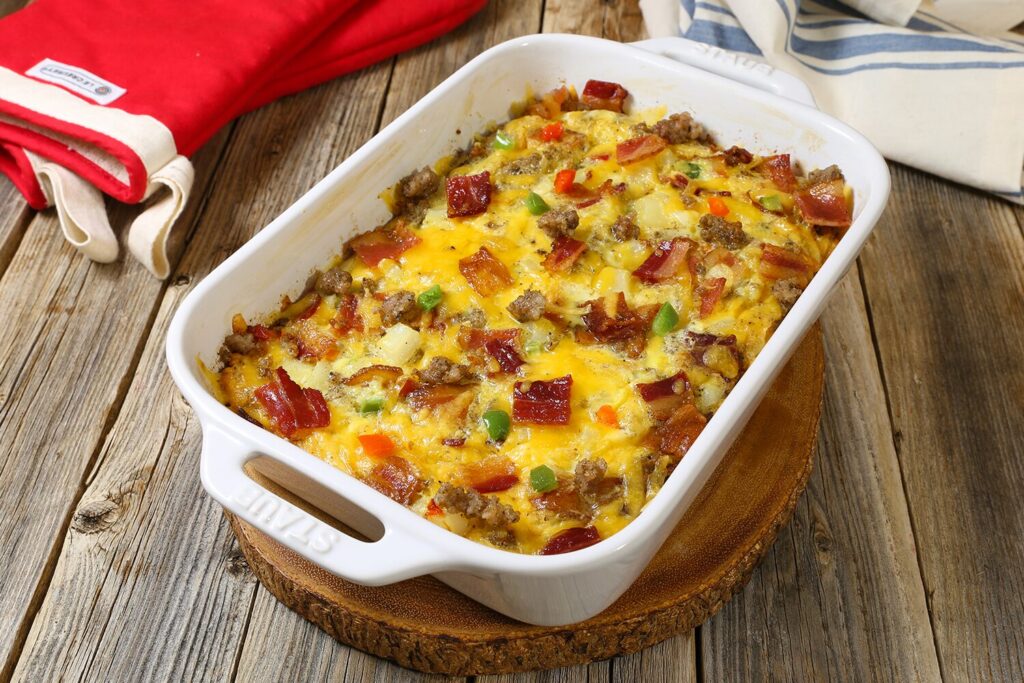 Cheesy breakfast casserole with Jones Dairy Farm bacon, pork sausage, hash browns, and cheddar cheese