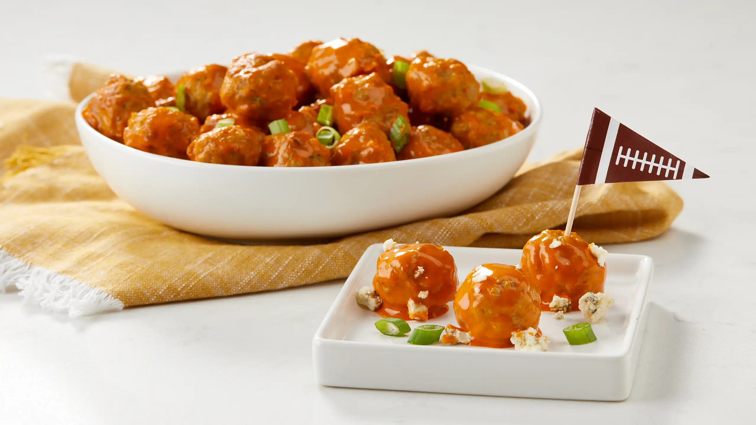 Jones Dairy Farm buffalo meatballs with blue cheese and green onions served as a game day appetizer