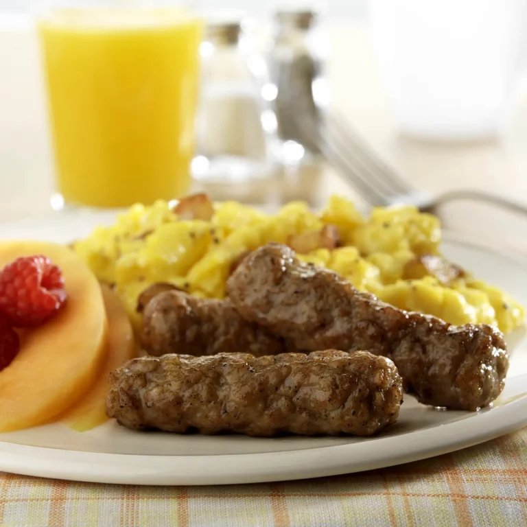 Jones Dairy Farm skinless breakfast sausage links served with scrambled eggs, fresh fruit, and orange juice