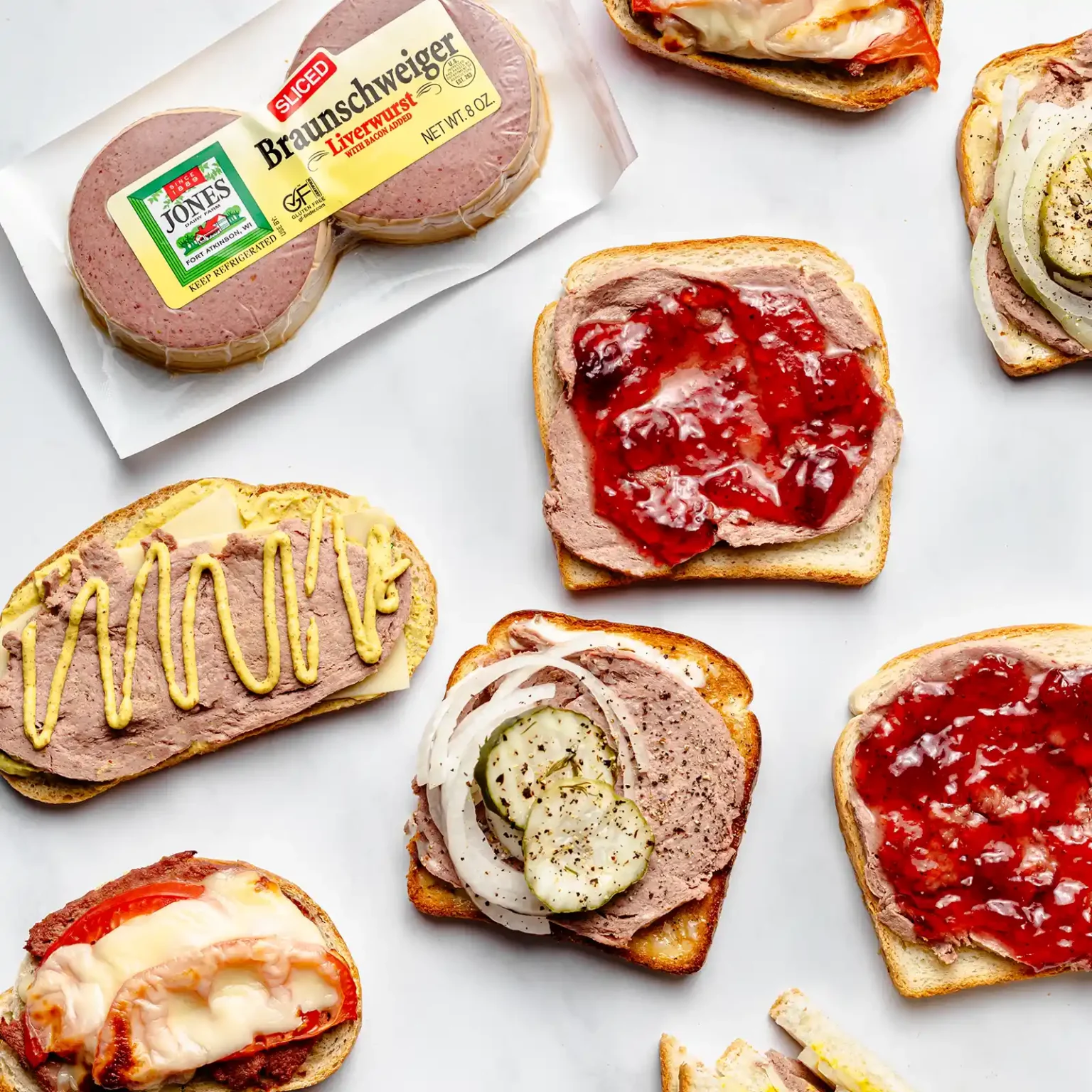 Jones Dairy Farm sliced Braunschweiger liverwurst package with open-faced sandwiches topped with mustard, jam, pickles, onion, and melted cheese