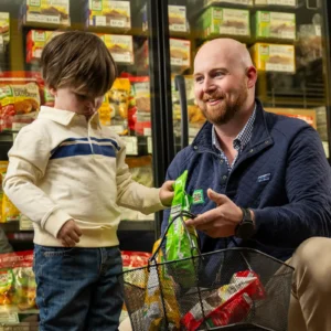 Will Jones and his son shopping for Jones Dairy Farm products at Jones Market