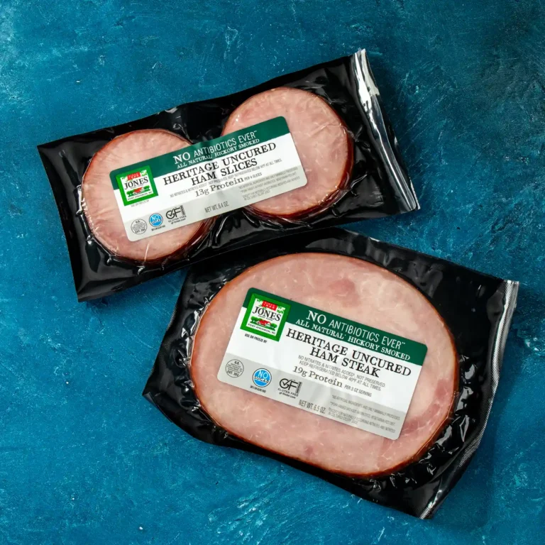 Jones Dairy Farm Heritage Ham Slices and Heritage Ham Steak packages on a blue background