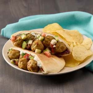 Jones Dairy Farm meatball pita pockets with tzatziki, cucumber, tomato, and feta served with potato chips