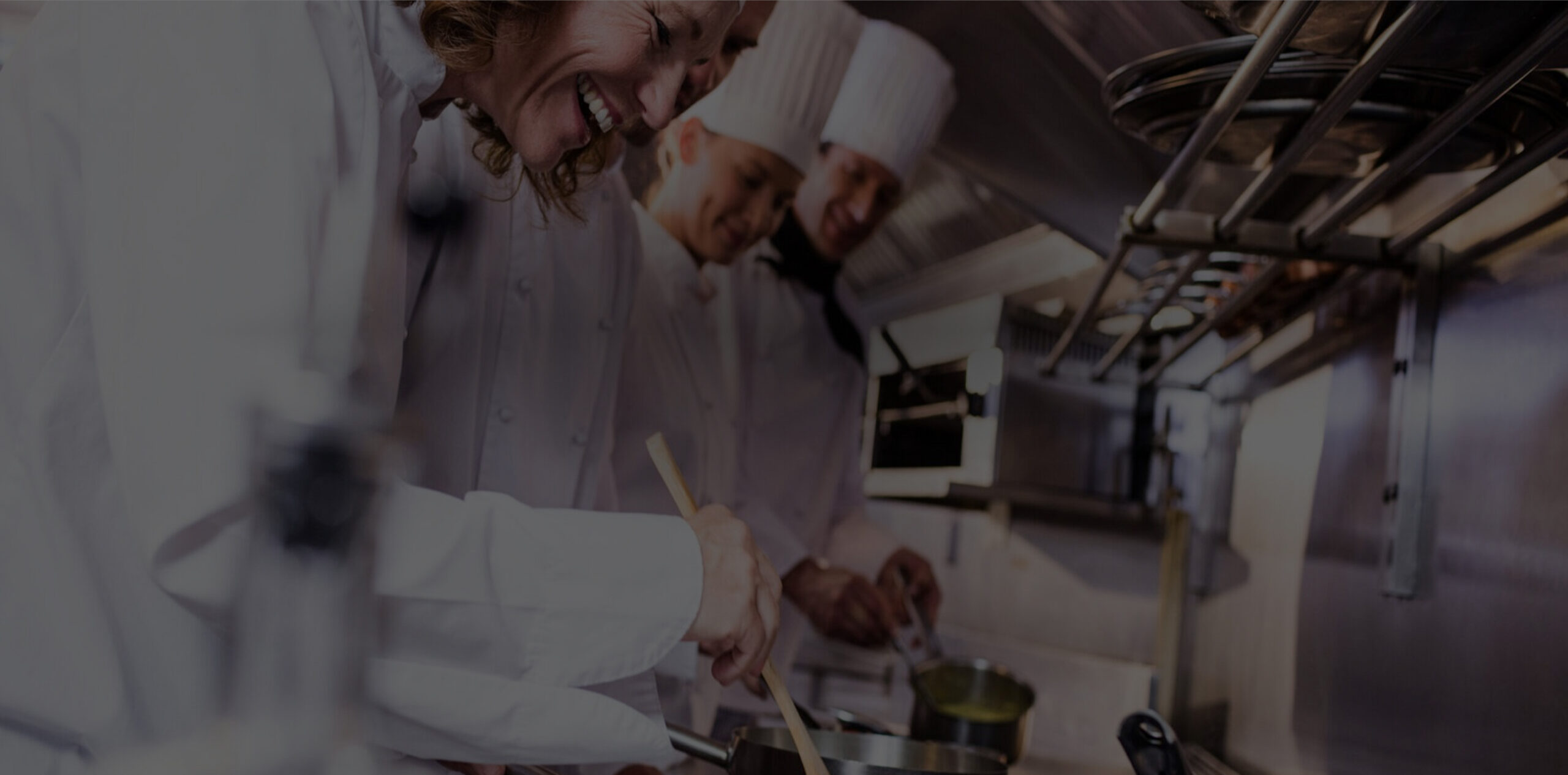 Chefs cooking together in a professional kitchen