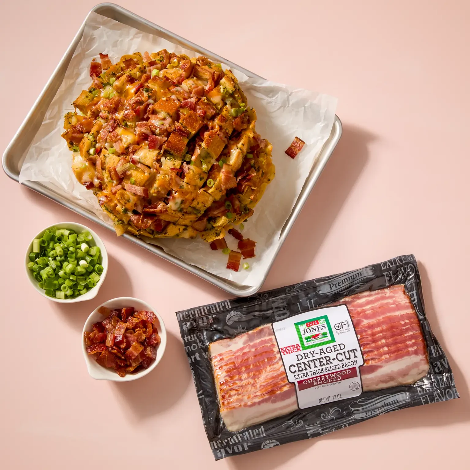 Jones Dairy Farm dry aged extra thick cherrywood smoked bacon package with a bacon and cheese pull-apart bread appetizer