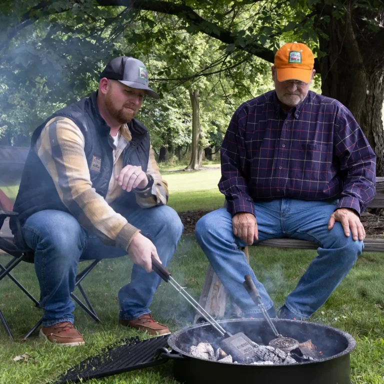 Will Jones and Philip Jones cooking pudgy pies over a campfire