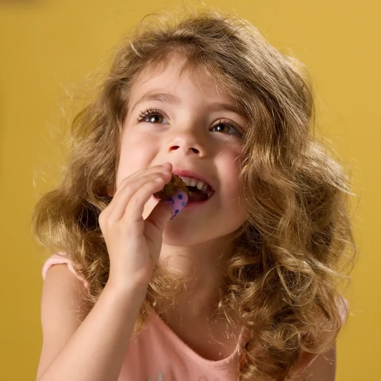 alt text for this please, on the education landing page for foodservice1:32 PMClaude responded: A young girl eating a Jones Dairy Farm All Natural sausage link on a yellow backgroundA young girl eating a Jones Dairy Farm All Natural sausage link on a yellow background