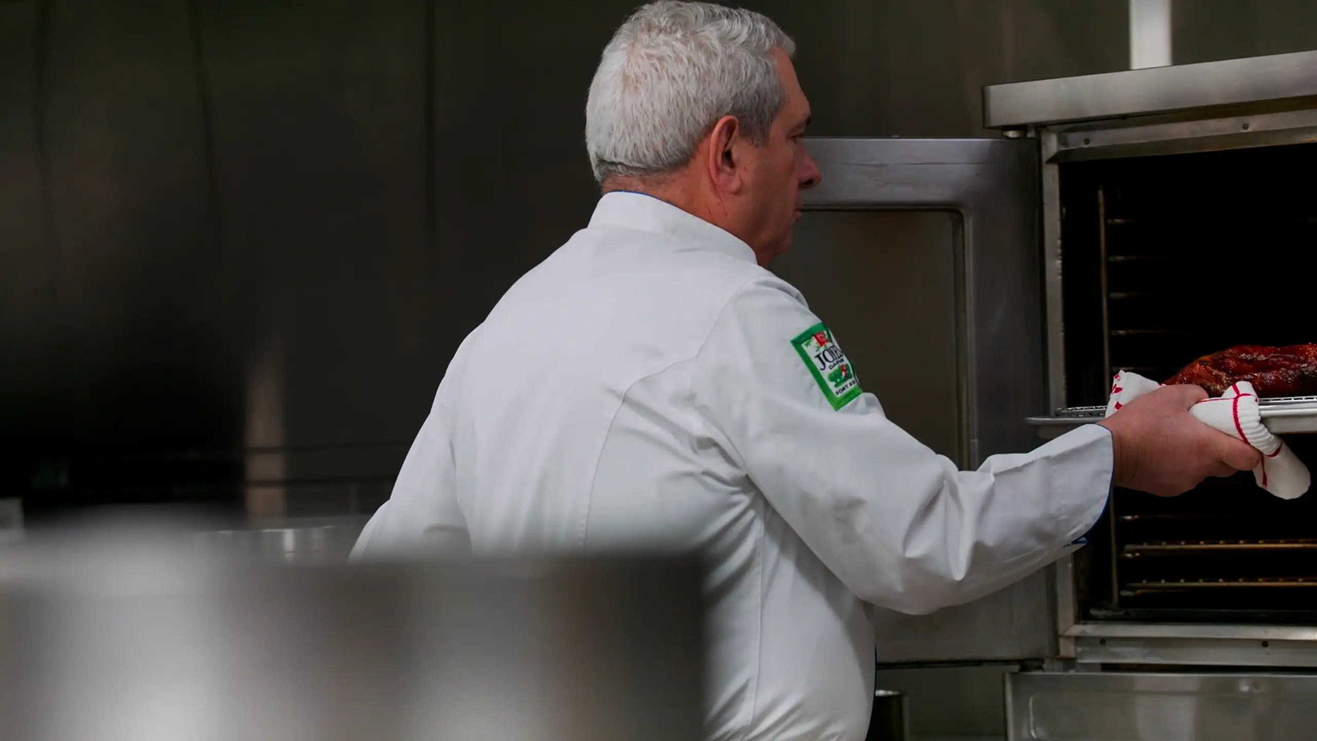 Chef John Coletta prepares Jones Dry Aged Bacon Slab