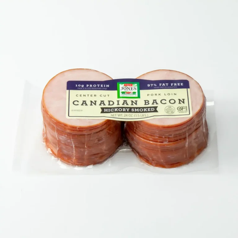 A 24 oz. twin-pack of Jones Foodservice Center Cut Hickory Smoked Canadian Bacon, showing two stacked portions of pre-sliced pork loin in clear packaging against a white background.