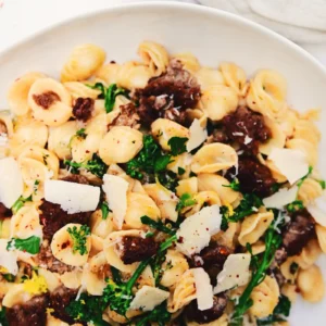 Orecchiette pasta with sausage, broccoli rabe, parmesan shavings, and red pepper flakes.